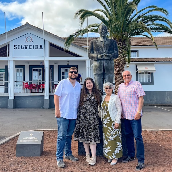 Zac, Elaina, her grandma, and her grandpa in front of the Silveira community center in the Azores