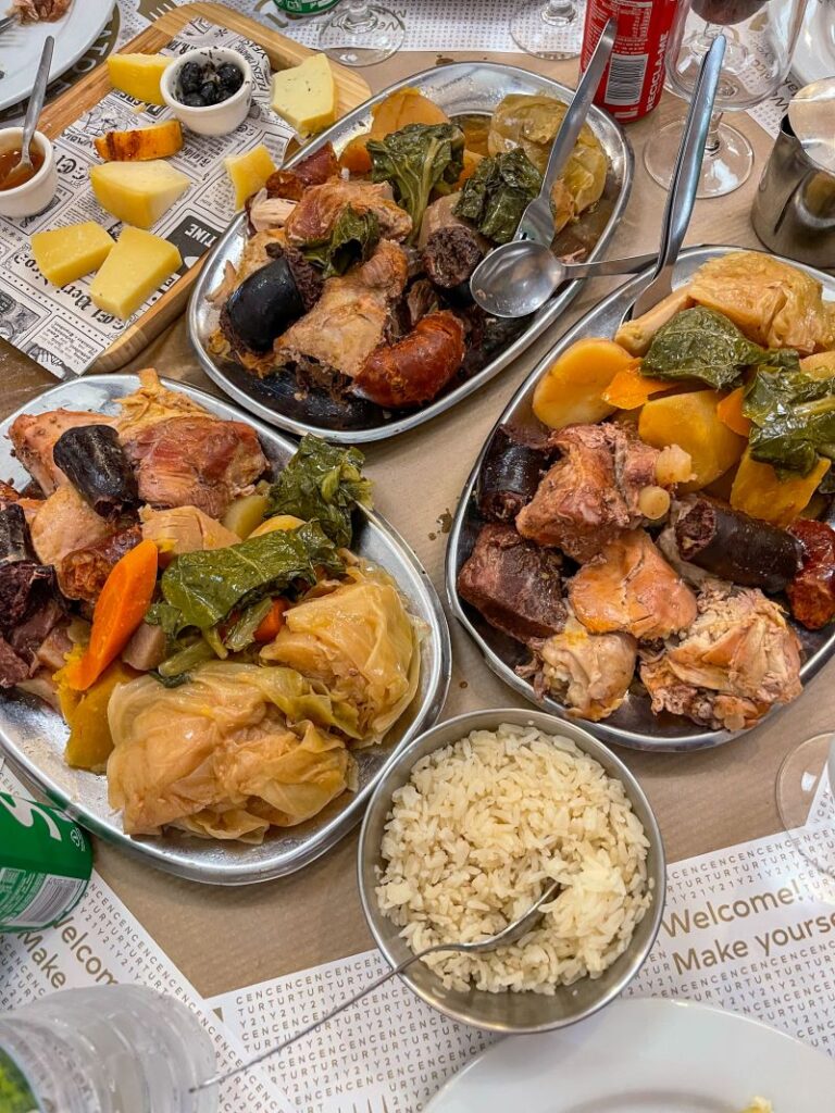 3 platters of meat, potatoes and vegetables that were cooked underground by the Furnas. 