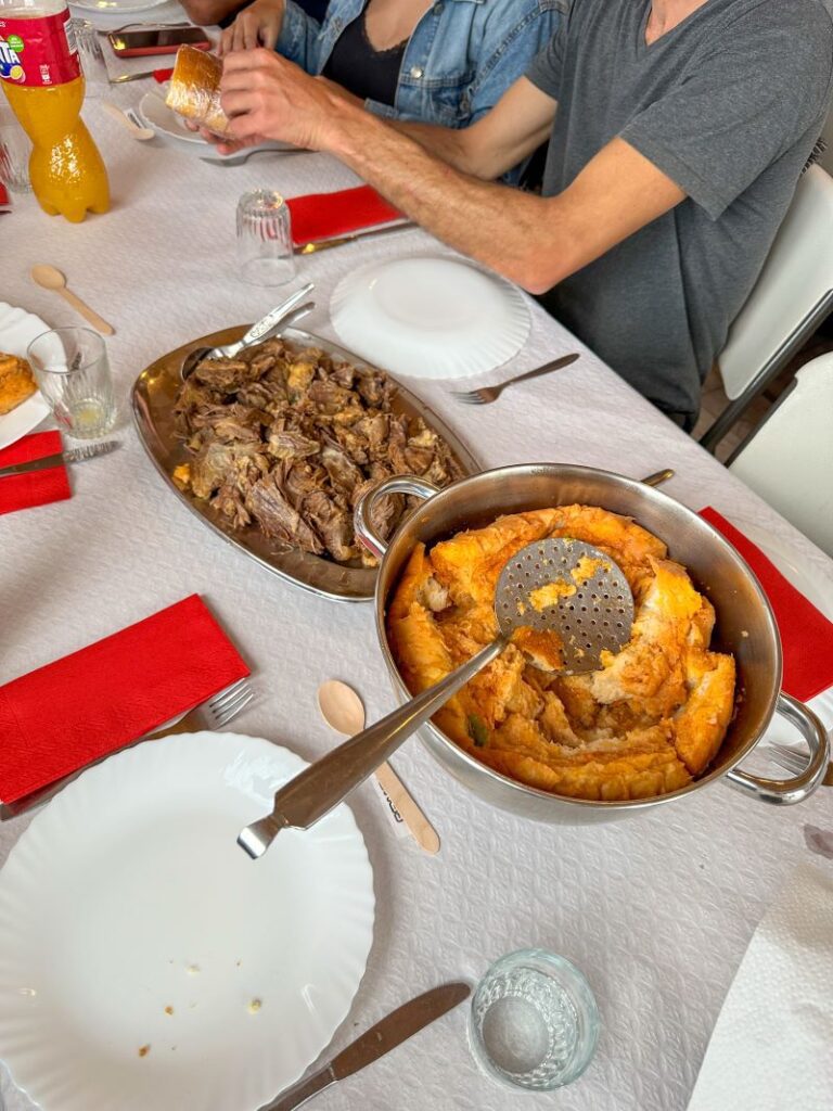 Platter of beef and bowl of sopas bread