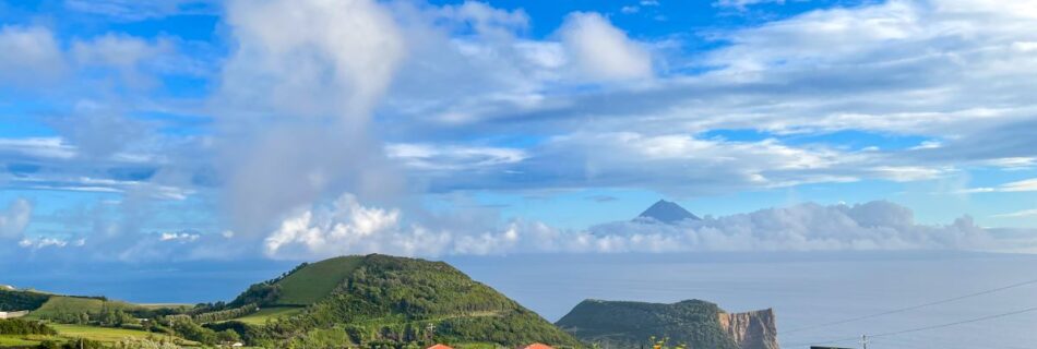 View of Mt. Pico peaking through the clouds from the neighboring island of Sao Jorge