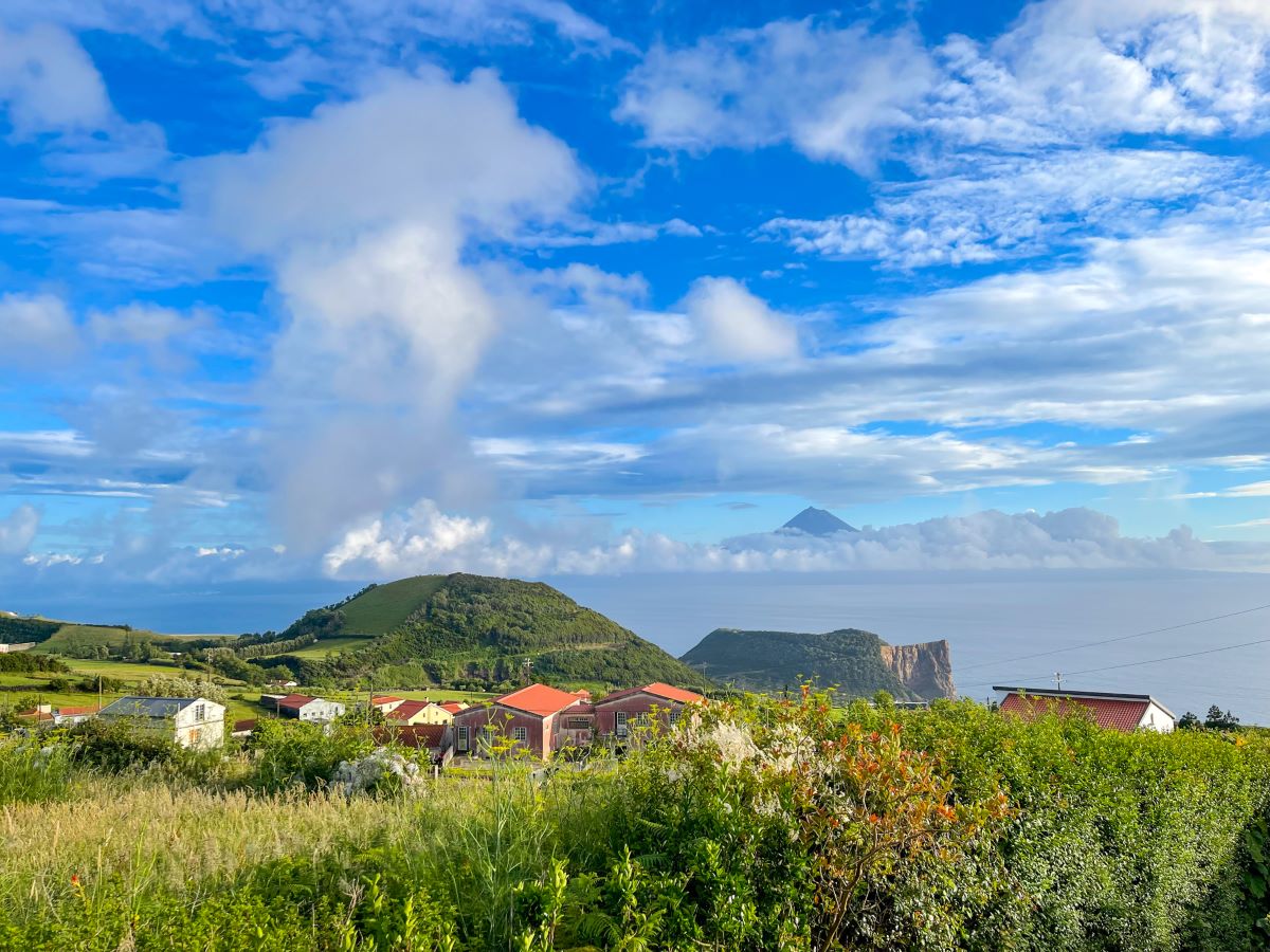 View of Mt. Pico peaking through the clouds from the neighboring island of Sao Jorge