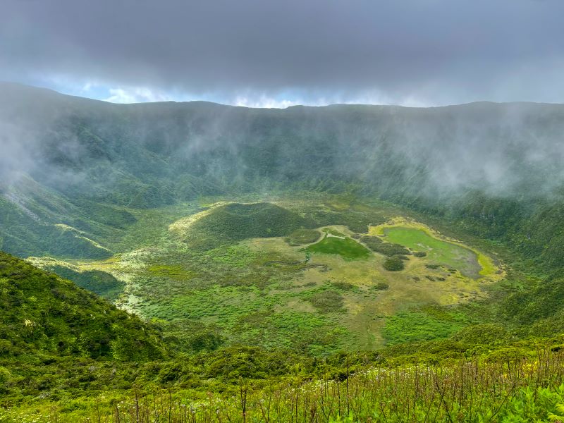 The Caldeira of Faial is covered in a light haze with the floor of the crater covered in plenty of green vegetation