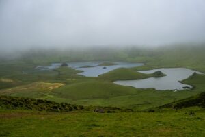 Corvo Caldeira on a foggy morning with lakes and pastures still visible