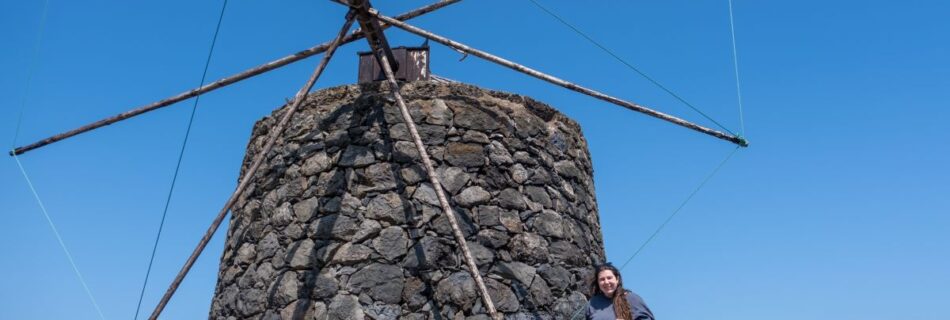 Elaina in front of one of the old stone windmills in Vila do Corvo