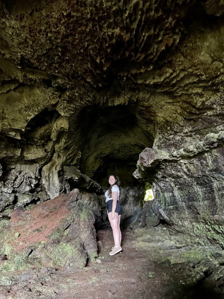 Elaina standing inside the cave Furna de Frei Matias