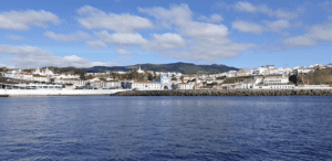 A view of the coast of Terceira island featuring Angra do Herosimo from the water.