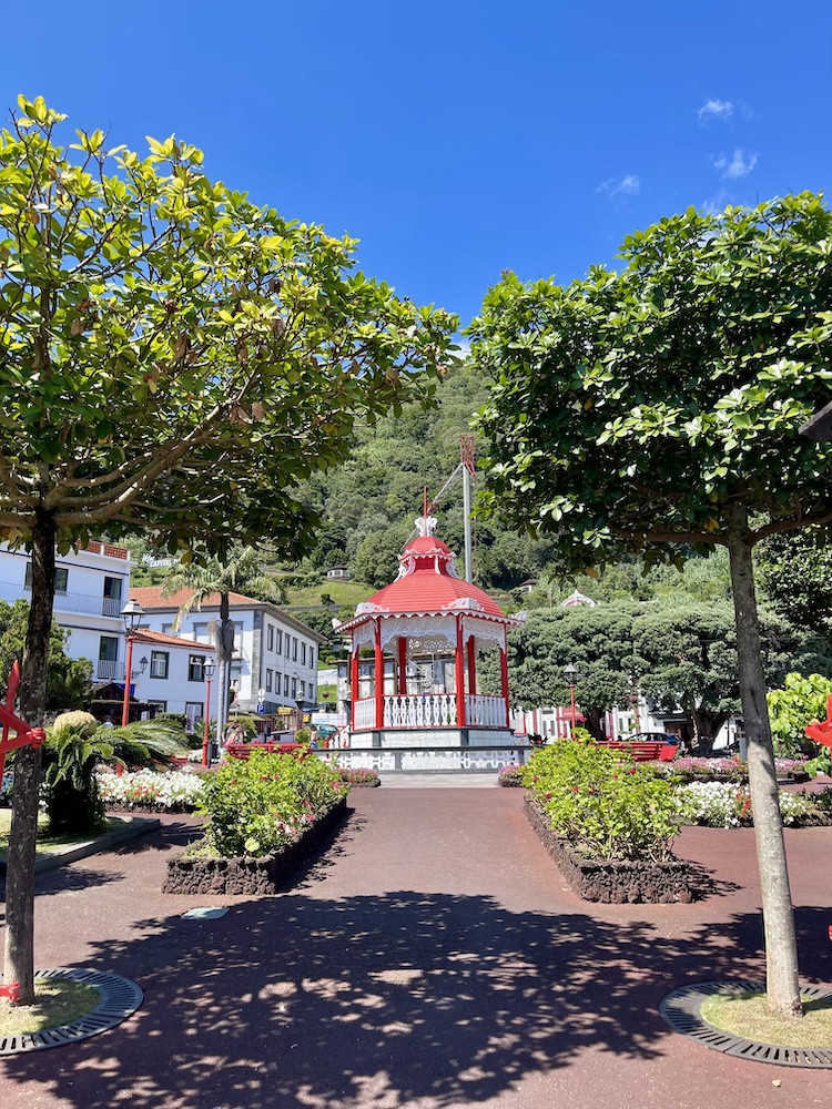 Path leading to a red and white gazebo in the middle of Jardim da República in Velas, São Jorge, Azores.