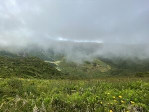 The Caldeira of Faial is covered in a light haze with the floor of the crater covered in plenty of green vegetation